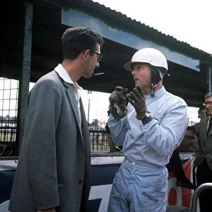 British Grand Prix 1962 Aintree July 1962 Phil Hill of Ferrari talking to unknown