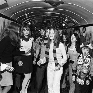 Burnley FC fans enjoy the mobile disco on board the soccer special. 27th January 1973