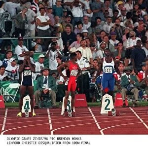 Canadas Donovan Bailey crosses the finish line to take the Gold medal in the mens