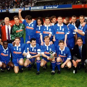 The Cardiff City team pictured with the Third Division title trophy