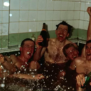 Celtic players celebrate in team-bath April 1988