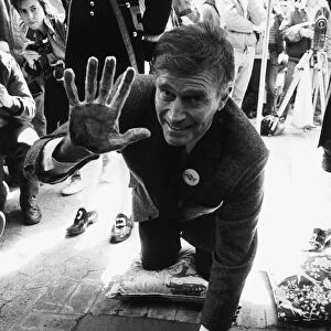 Charlton Heston Actor putting his hand prints in cement at Star Pavement in London
