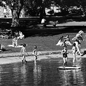 Children playing in the lake at Albert Park, Middlesbrough, North Yorkshire