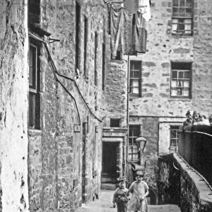 Children playing in the street behind Holy Trinity Church, Coventry circa 1924