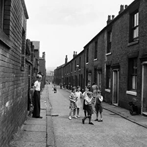 Children playing in the streets of Oldham. July 1952 C3299-002