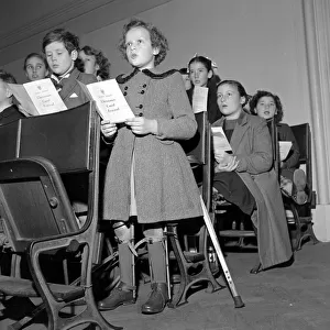 Children rehearse for the Carol Festival at the Central Hall Westminster December