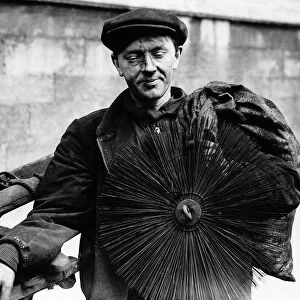 Chimney sweep in London with with brush and rods, May 1937