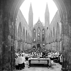 A church service in the bombed out remains of Norwich Cathedral
