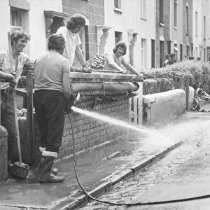 Cleaning up after floods in Lypiatt Road, St George, Bristol in 1974