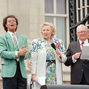 Cliff Richard, Dame Vera Lynn and Harry Secombe, singing for the crowds gathered at