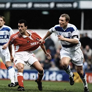 Clive Mendonca of Charlton has his shirt pulled by Tim Breacker of Queens Park Rangers