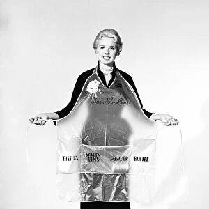 Clothing: Apron: Woman wearing the new Boss Baby apron. 1957 B264