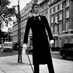 Clothing: Fashion Menswear. Ralph wearing a Black Trevira Maxi Coat and trousers