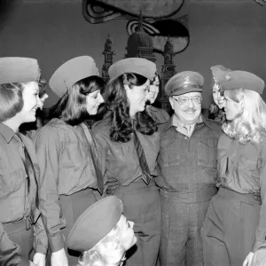 Comedy actor Arthur Lowe of Dads Army surrounded by girls