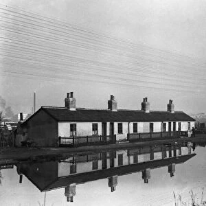 Cottages reflected in the Grand Union Canal near Uxbridge Circa 1934