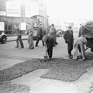 Council workmen seen here repairing a road in Kingston Upon Thames January 1939