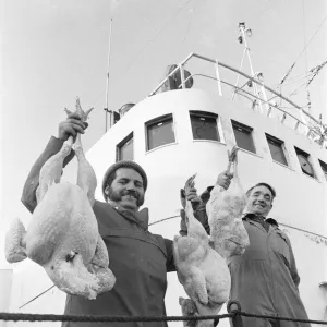 Crew members of the Hull trawler Lord Nelson show off their Christmas turkeys as they