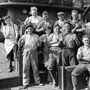 The crew of one of the small ships that helped with the evacuation of the British