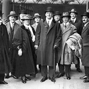 Cricketer C. B. Fry arrives at Brighton with some of his fans who met him