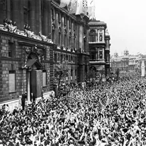 Crowd cheers British Prime Minister Winston Churchill after his victory speech from a