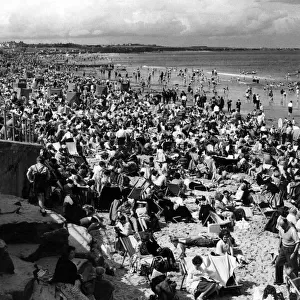 A crowded Whitley Bay beach, Tyne and Wear. 7th August 1961