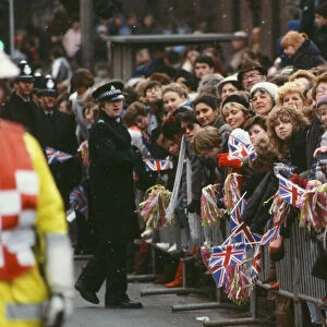 Crowds of well-wishers wait patiently for the arrival of Princess Diana