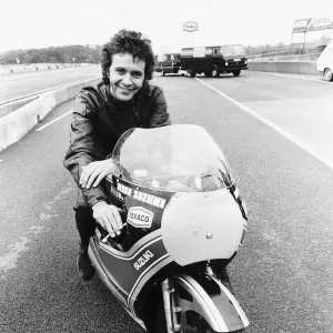 David Essex on the set of his film Silver Dream Racer sitting on a £40