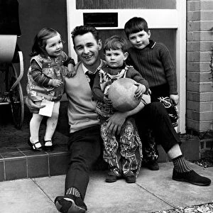 Derby County manager, Brian Clough, pictured at home with his children, Elizabeth