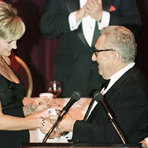 Diana, Princess of Wales receives an award former US Secretary of State Henry Kissinger
