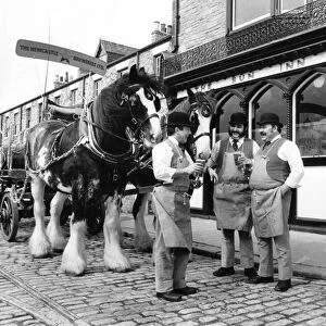 Draymen of yesteryear enjoy a pint outside The Sun Inn at Beamish Museum