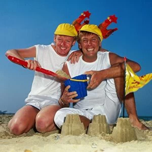 Dustin Gee on the beach with fellow comediy partner Les Dennis, 1985