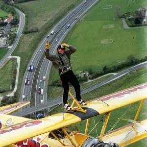 Eddie Kidd flying above M25 to publisize the Skip Lunch appeal Dbase MSI Glossary