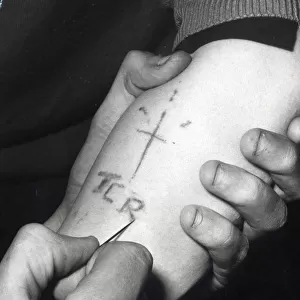 Edinburgh gangs January 1973 a teenager with his sleeve rolled up getting tattoed
