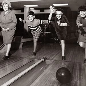 Four elderley women who are part of a newly formed tenpin bowling team practcie their