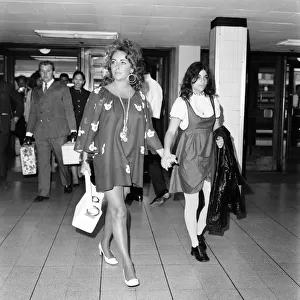 Elizabeth Taylor and Richard Burton with daughter Liza leave London Airport (Heathrow