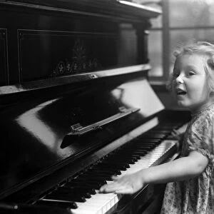 Ella Edwards playing the piano. January 1941