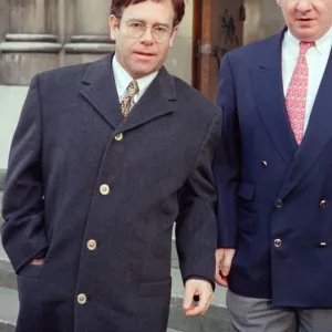 Elton John and his manager John Reid at the High Court for a Libel Case against