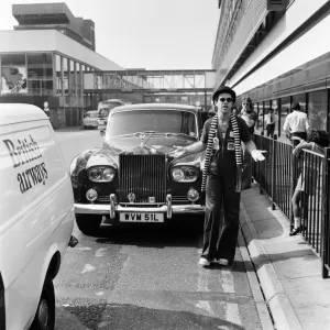 Elton John, pictured with his Rolls Royce. On his arrival from a recording session in Los