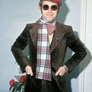 Elton John wearing tartan hat and cap March 1979