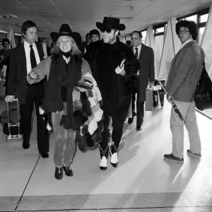 Elton John and Zandra Rhodes at Heathrow. 11th January 1981