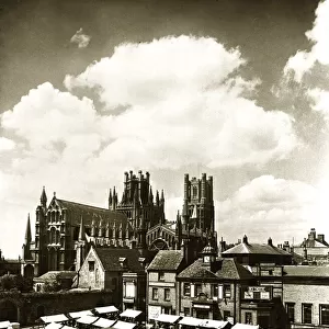 Ely Cathedral Cambridgeshire over looking the town square on a market day