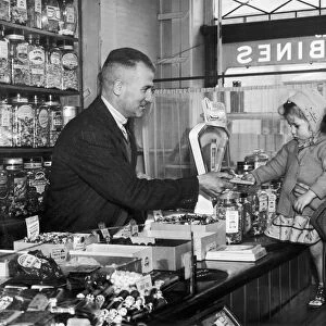 Ex-England cricketer Harold Larwood in his sweet shop in Blackpool 10th April 1949