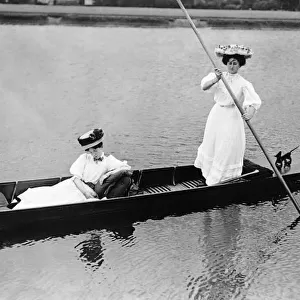 Fashion of 1919 with women in Edwardian dress punting on a lake Clothing