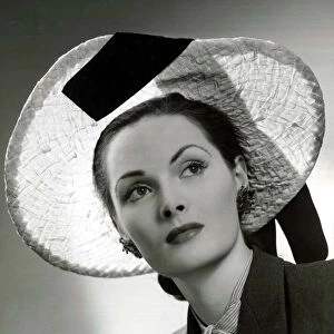 Fashion circa 1940 Natural plaited straw picture hat designed by Hugh Beresford
