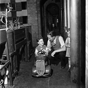 Father playing with his young son in Westminster, London. September 1950 O25749