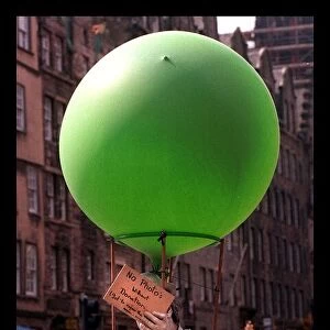 Some of the festival goers in edinburgh August 1998 Man holding green balloon
