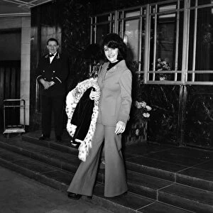 Film actress Elizabeth Taylor leaving her hotel in London as she prepares to fly to
