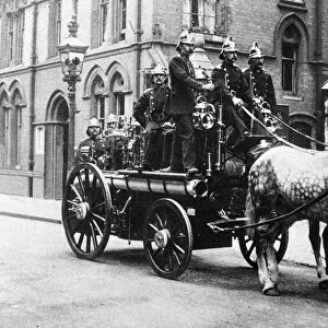 Firefighters from Central aboard their horse draw Steam fire engine, 1900