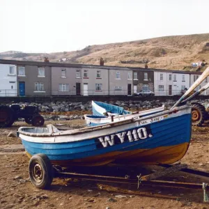 Fishing cobles are drawn up on the sea shore at Skinningrove where once boats arrived to