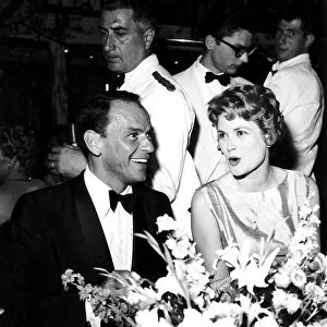 Frank Sinatra and Princess Grace of Monaco in a party in a club in Monte Carlo